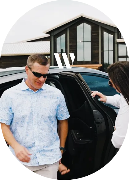 Guest exiting WhiskMe luxury bourbon trail transportation vehicle